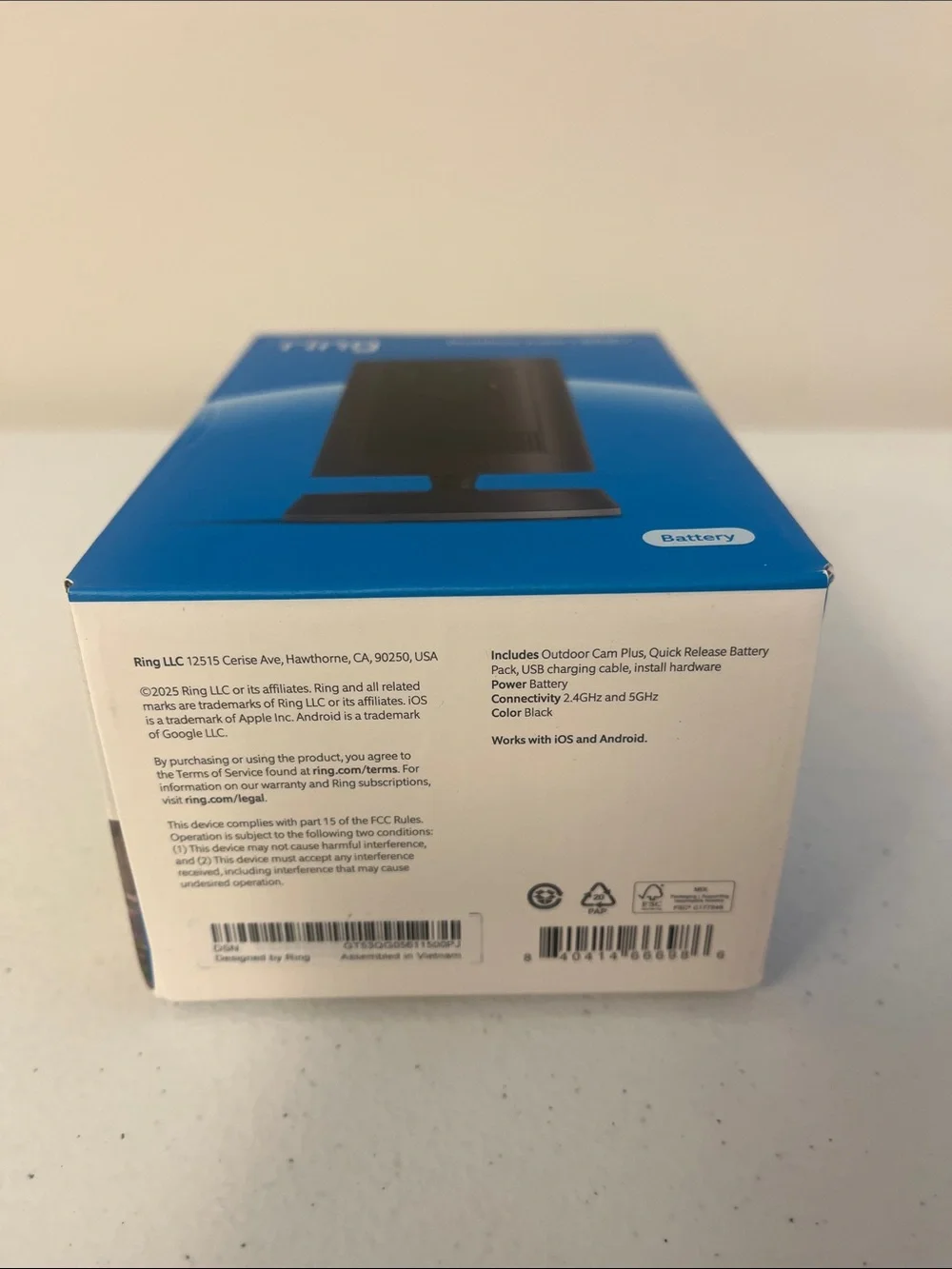 Ring Outdoor Cam Plus in black and blue packaging